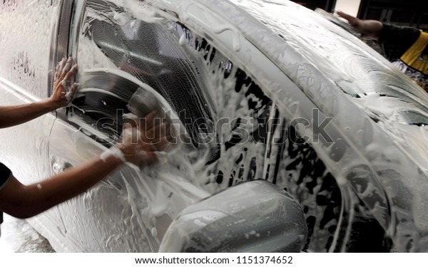 car cleaning process\
with bubble shampoo
