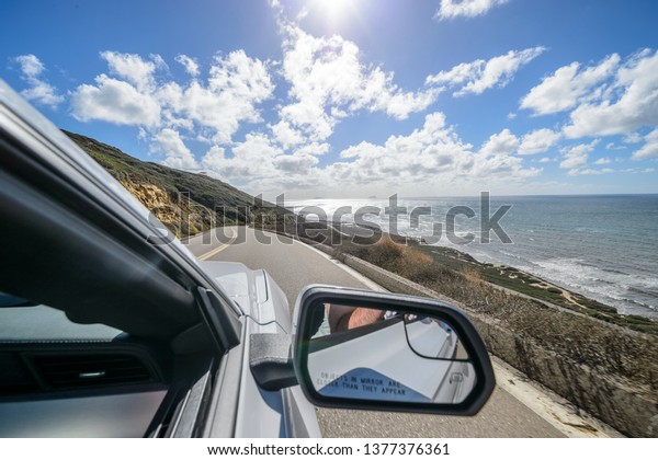 Car and coastline road
landscape background at Point Loma in San Diego, California at low
tide - Image
