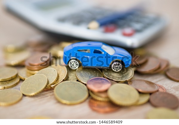 car\
with coins and calculator, expenses and car\
purchase