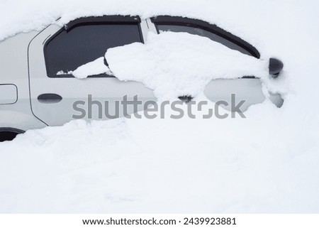 The car is completely covered in snow