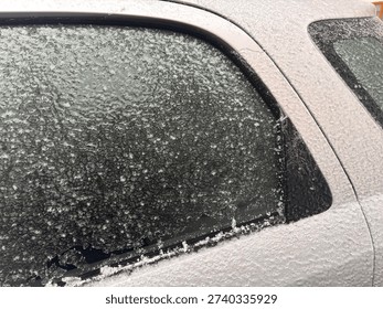 The car is completely covered in a thick layer of ice.