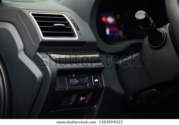 Car conditioner. The air flow inside the car.\
Detail interior. Air ducts, deflectors on the car panel. Vehicle\
control buttons