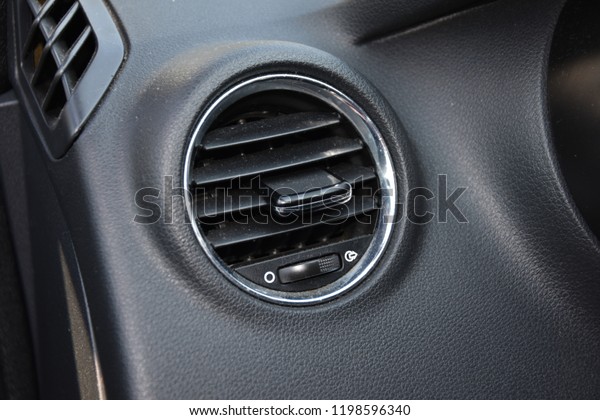 Car conditioner in used car. The air flow\
inside the car. Detail interior.\

