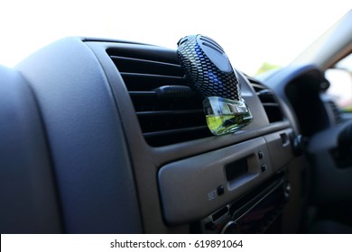 Car console and accessory on dashboard, perfume, small bag for put trivial things, air conditioner