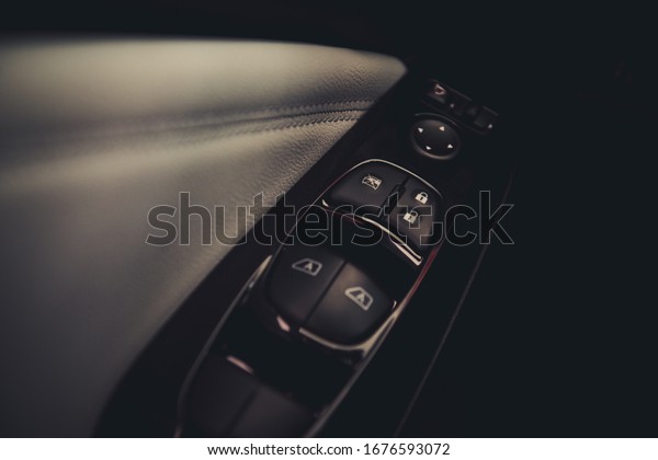 Car\
control panel auto button glass in a luxury\
car.