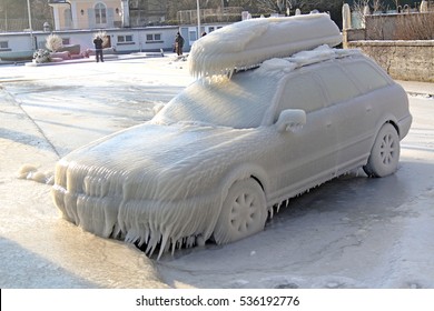 Car covered by ice at the Versoix promenade, Lake Geneva, Western Switzerland