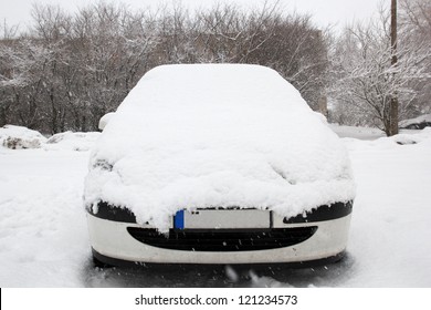 Car Covered With Fresh White Snow