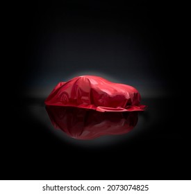 Car covered in red cloth, ready for reveal, concept car, motor show - Shutterstock ID 2073074825