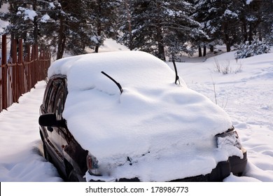 Car Covered In Snow