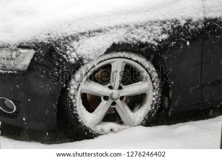 Car covered with snow after heavy snowfall