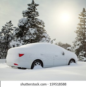 Car Covered With Snow In The Forest