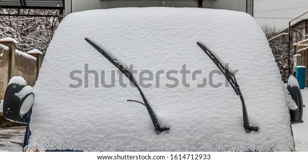 Car covered with thick\
snow close-up