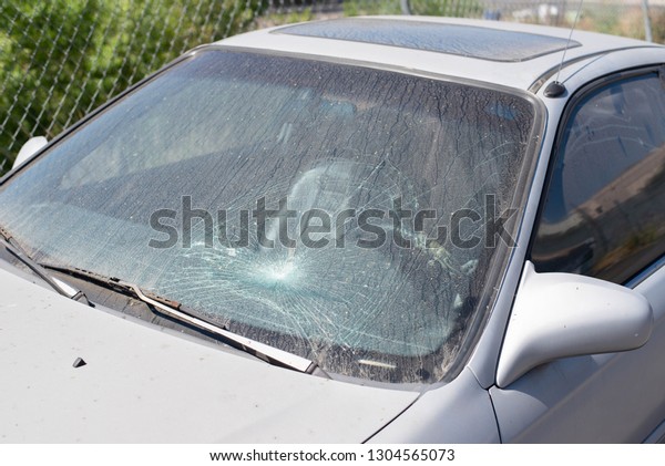 Car cracked or broken\
windshield.