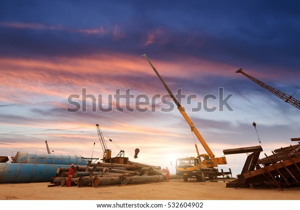 Car crane lifts the\
ship