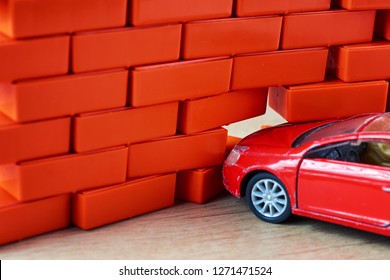 Car Crash Accident. Automobile Hit A Brick Wall. Car Insurance Concept