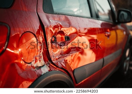 Car crash or accident. Front fender and light damage and scratchs on bumper. Broken vehicle detail  repair in car service. Automobile industry