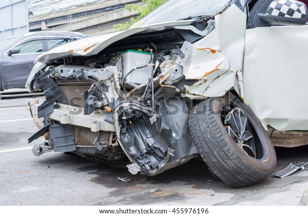 Car crash from car accident on the road in a\
city wait insurance.