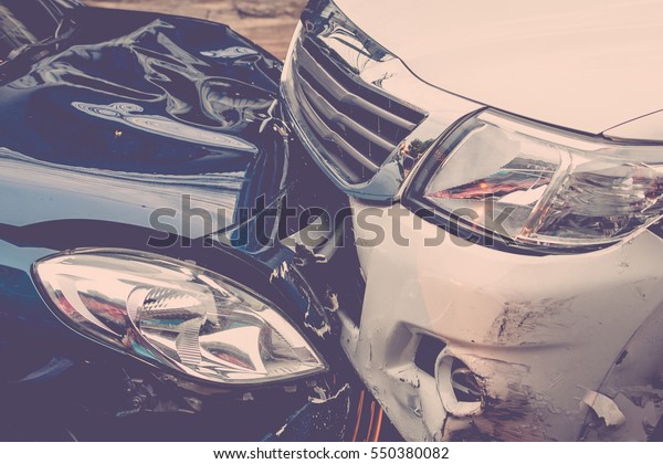 Car\
crash from car accident on the road in a city between saloon versus\
pickup wait insurance. , process in vintage\
style