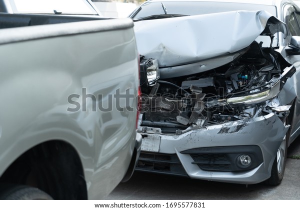 Car crash accident on the road.Damaged\
automobiles after crashing by drunk driving.Traffice jam by cars\
accident collision.