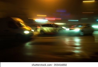 Car Crash Accident On The Street Of The City At Night. Intentional Motion Blur