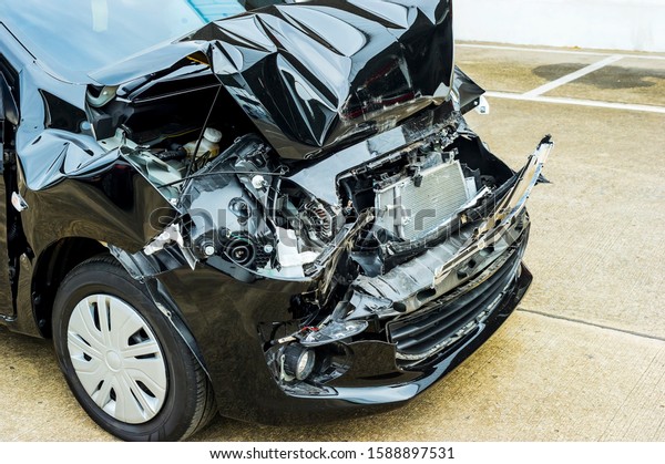 car crash accident on street, damaged automobiles\
after collision in city, damaged accident car waiting for repair in\
the garage
