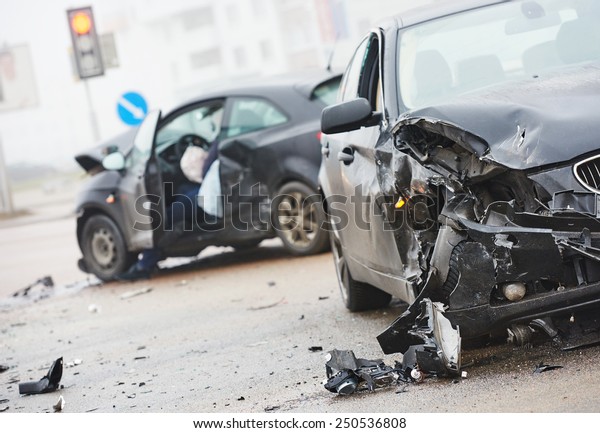 car crash accident on street, damaged automobiles\
after collision in city