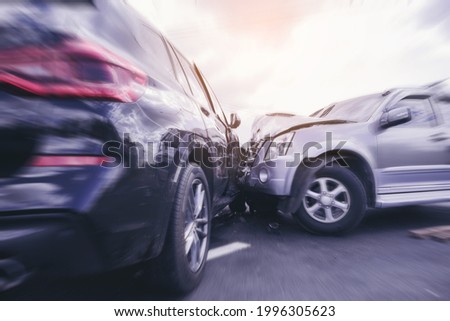 Car crash dangerous accident on the road. SUV car crashing beside another one on the road with speed zoom blur.