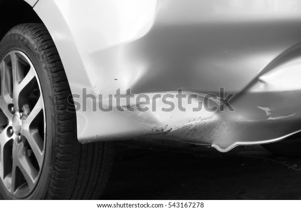 Car crash. Detail of trace of car crash. On trunk\
car. Black and white theme.
