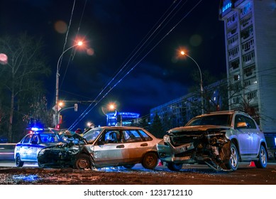 Car Crash On City Road At Night With Shallow Depth Of Field