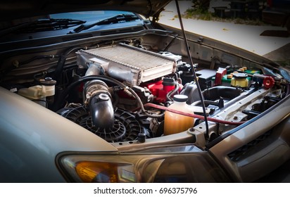 Car crash open hood mechanic to check condition of damage. See the radiator cooling panel Engine and electronic system for mechanic to check damage thoroughly to repair engine car to complete for use - Shutterstock ID 696375796