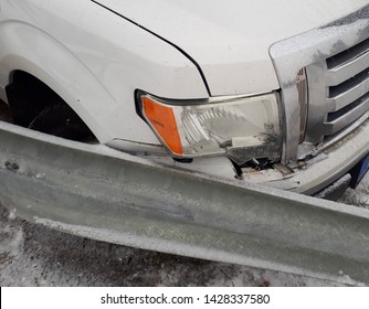 Car Crash Results In Crushed Headlight Against A Broken Barrier, A Minor Fender Bender 