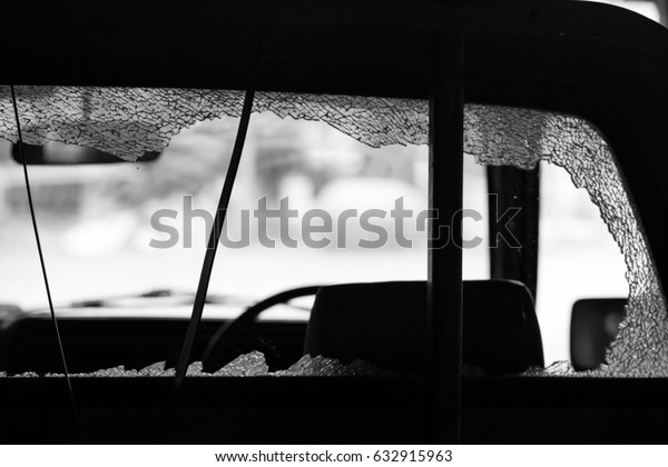 Car\
crash, shattered glass, low light image\
concept