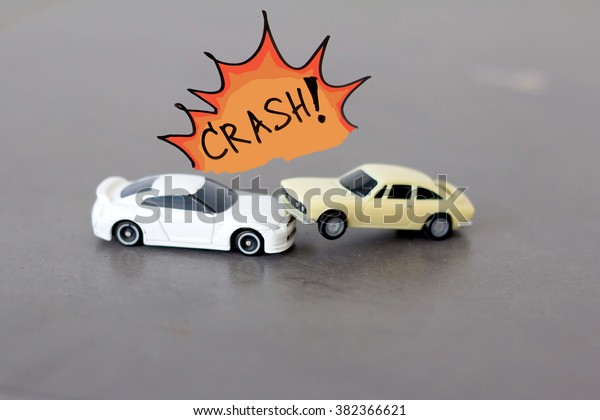 Car crashing accident , small toy car crashing ,\
car insurance concept.