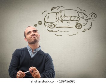 Car credit concept. Man dreaming about car