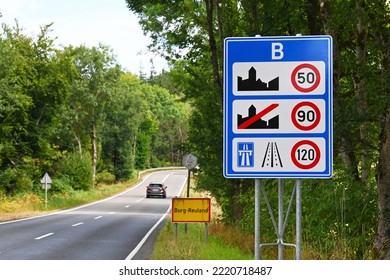 Car crosses the border from Luxembourg to Belgium. Sign of Speed limits at the border of Belgium - Shutterstock ID 2220718487