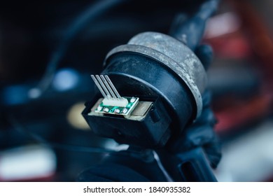 Car Cruise Control Module In The Hands Of A Car Mechanic.