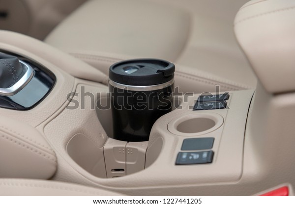 car in cup\
holder coffee cup, modern car\
interior