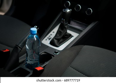 In A Car In A Cup Holder There Is A Bottle Of Water