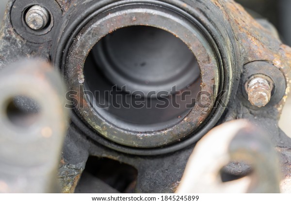 Car\
cylinder brake drum, old and rusty, close up\
view.