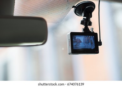 A Car Dash Cam Mounted On The Front Windshield Recording The Traffic Ahead In Case Of An Emergency Situation Or An Accident.