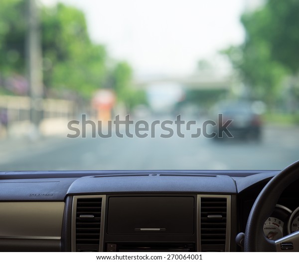 Car dash panel with blurred street\
background for transportation product\
display