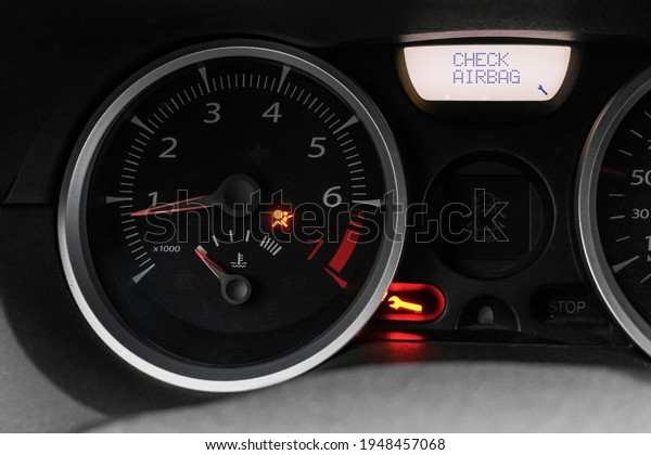 Car dashboard with airbag\
error warning, malfunction. Car service and repair. The dashboard\
is close.