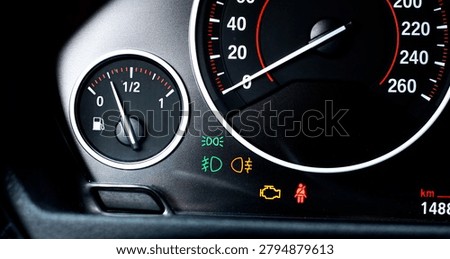 Car Dashboard Background with Engine Warning Light, Headlight Indicator, Speedometer and Fuel Gauge