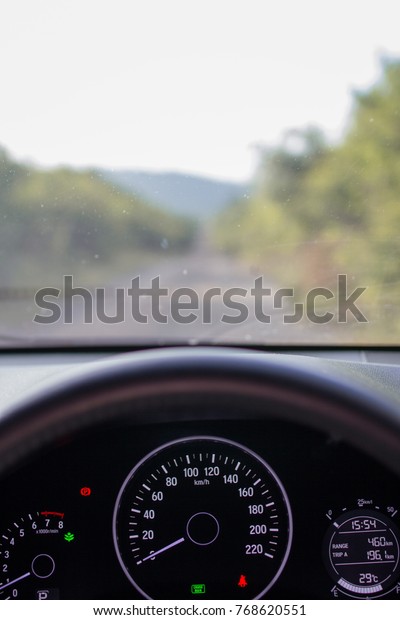 car dashboard and blurred nature background,\
adventure  holiday concept