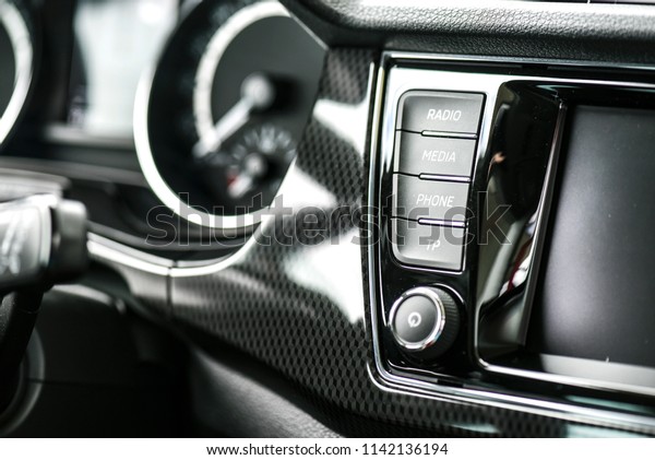Car\
dashboard buttons like volume, climatronic, navigation,\
display,menu, setup, sound  and speed control\
meter.