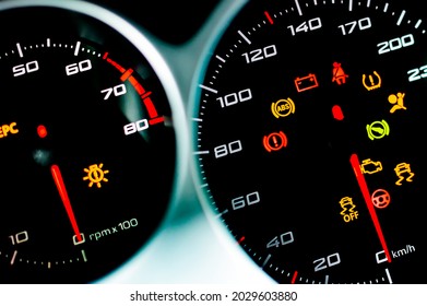 Car dashboard. Checking the system when starting the engine. A close-up of the speedometer and tachometer with additional instruments is illuminated. 