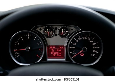 Car Dashboard. Close up image of illuminated car dashboard.