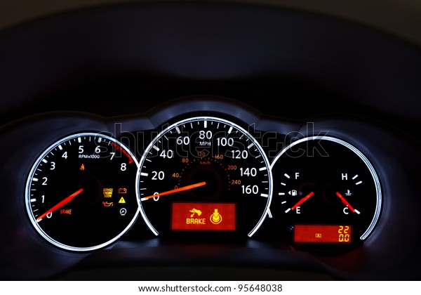 Car Dashboard. Close up image of illuminated\
car dashboard.