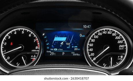Car dashboard features a speedometer and fuel gauge with digital display showing 201 km trip distance and outdoor temperature at 29 degrees Celsius.