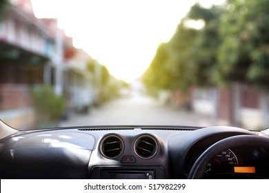 car dashboard in front of village